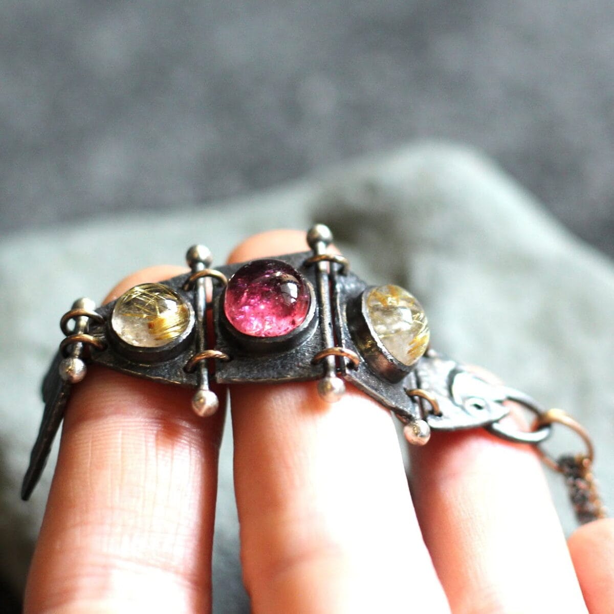 Silver and bronze kinematic fish pendant - Image 2