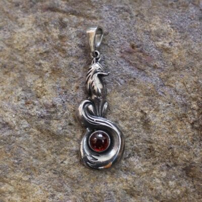 Sitting symbol fox with stone